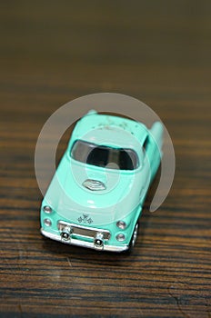 Blue vintage toy car on table