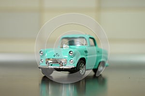 Blue vintage toy car on table