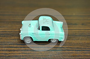 Blue vintage toy car on table