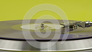 blue vinyl record spinning on turntable isolated on yellow. LP player in motion