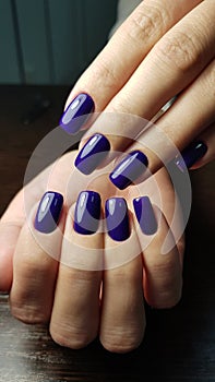 Blue or violet manicure both hands