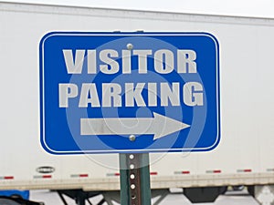 Blue visitor parking sign