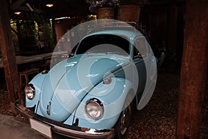 A blue volkswagen beetle. A classic, blue Volkswagen Beetle car.