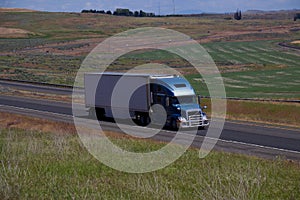 Blue Volvo Smei-Truck / White Unmarked Trailer