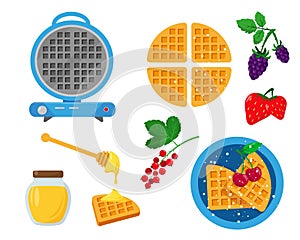 Blue waffle maker with waffles, berries and honey