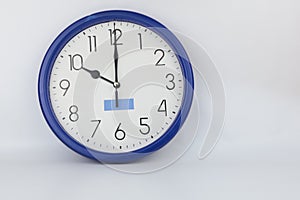 Blue wall clock stopped at 10