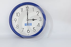 Blue wall clock stopped at 3