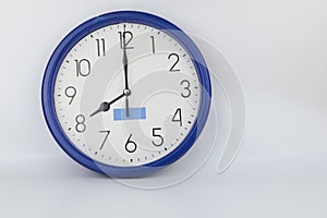 Blue wall clock stopped at 8