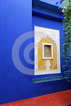 Blue wall with islamic art window.