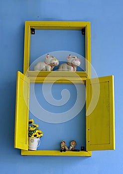 Blue wall with yellow window display