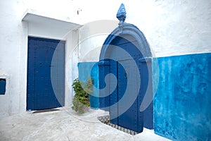 Blue painted doors and walls in Kasbah of the Udayas, Rabat, Morocco photo