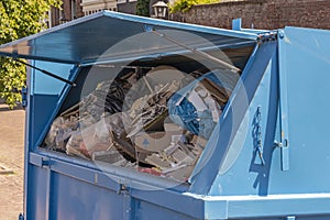 Blue waste container with open flap