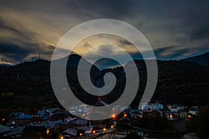 Broto city panoramic in pirineos at sunset on a cloudy sky photo