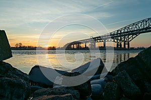 The Blue Water Bridge in Port Huron Michigan at sunrise facing canada photo
