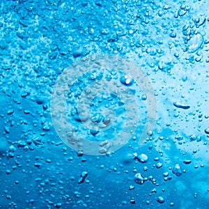 Blue water bubbles from a scuba diver