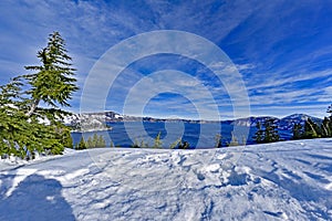 Blue Water Crater Lake with snow and cloud