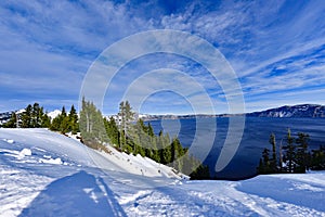 Blue Water Crater Lake with snow and cloud