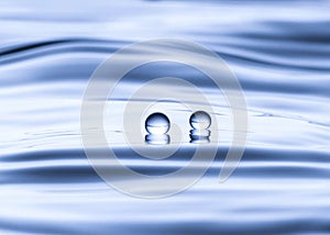 Blue water drop falling down