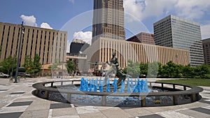 Blue water fountain with Runner Statue at Kiener Plaza Park in St. Louis - ST. LOUIS, UNITED STATES - JUNE 19, 2019