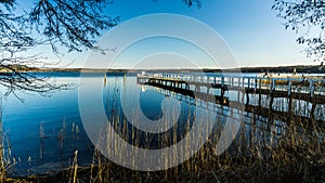 Blue water of lake with landing stage