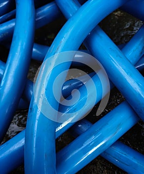 Blue water pipe line, multiple stacked pipes