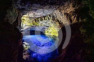 The blue water of Poco Encantado or Enchanted Well, in a cave at Itaete, Chapada Diamantina, Bahia, Brazil photo