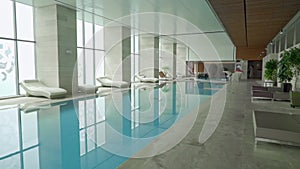 Blue water pool in a large room