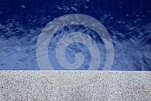 Blue water rippled background in swimming pool.
