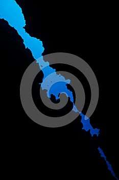 Blue water through the roof of an underwater cave