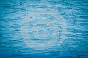 Blue water surface background texture blurred light with wave ri