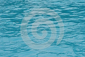 Blue water surface and ripple wave in swimming pool