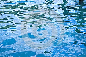 Blue water surface with small waves