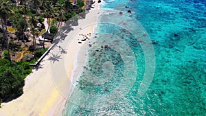 The blue water swashing over at a shoreline of a beach