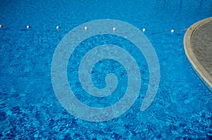 Blue water in the swimming pool, safety buoys