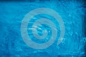 Blue water texture as abstract background, swimming pool and waves design