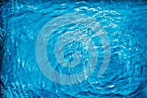 Blue water texture as abstract background, swimming pool and waves design