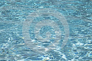 Blue water texture background. Background of pool water surface. Blue aqua water surface. Blue pool water texture background