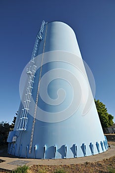 Blue water tower with latter photo