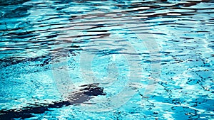 Blue water wave. Pool water texture surface. Summer sea abstract pattern.