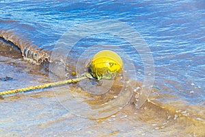 Blue water waves and ocean with buoy and ropes Mexico