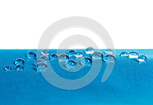 Blue waterproof fabric with waterdrops