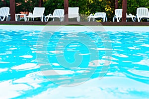 Blue waters in outdoor swimming pool