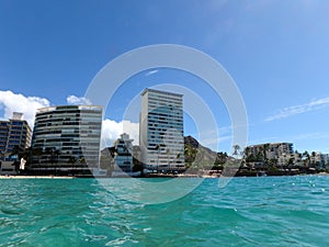 Blue waters of Waikiki with Hotels and Diamond Head in view