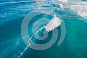 Blue wave in tropical ocean. Breaking barrel wave. Aerial view