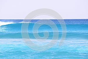 Blue waves bring ocean spray to the rocks of Boca Beach waves
