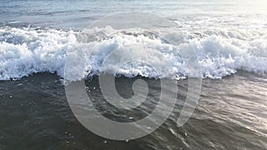 Blue waves surfing on ocean tropical beach