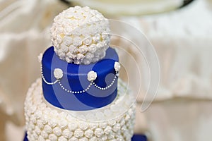 Blue wedding cake decorated with flowers