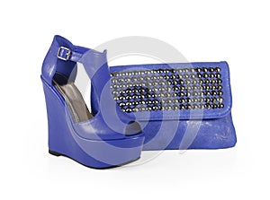 Blue wedge shoes and spiked bag