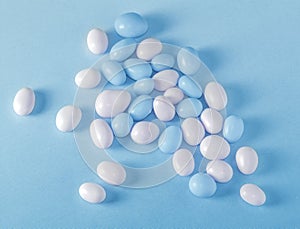 Blue and white candy dragees.