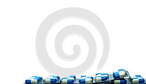 Blue-white capsule pills in blister pack isolated on white background with copy space for text. Antibiotics drug resistance